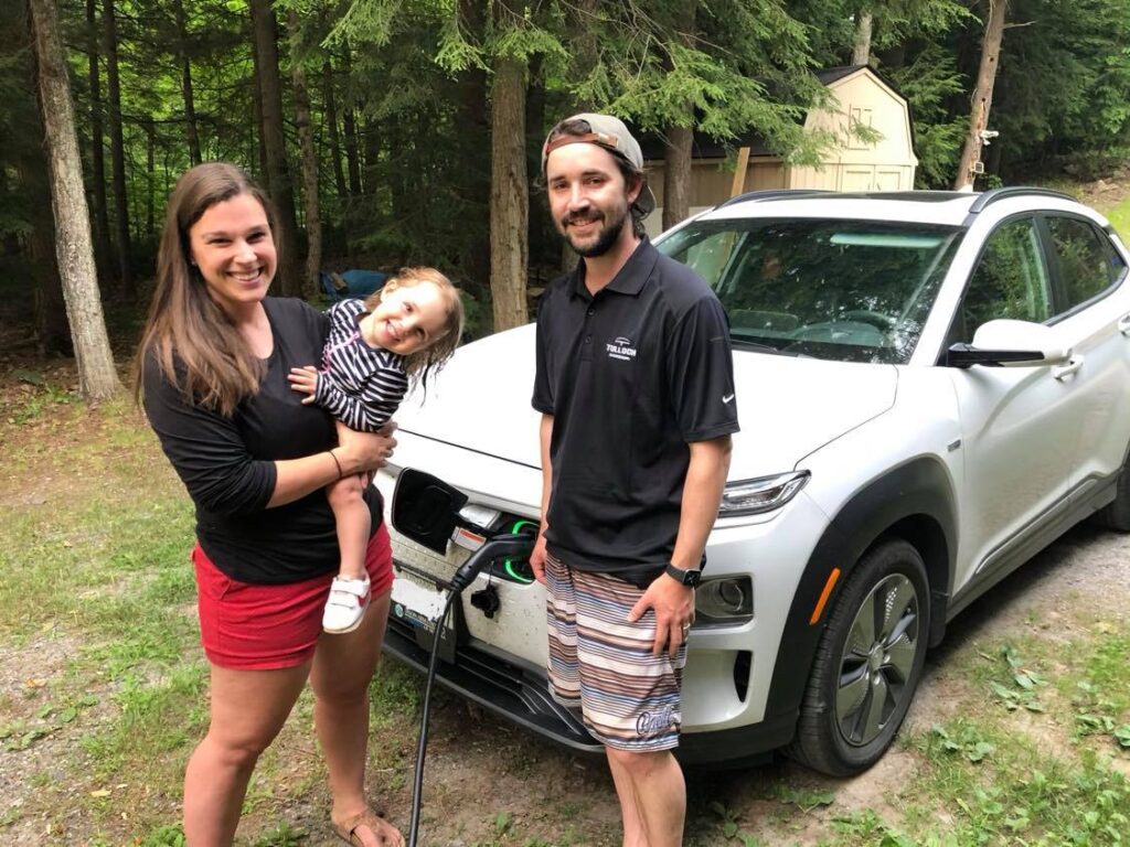 Electric Vehicle enthusiast Mark Walker with his wife Ellen, daugher Meredith and their Hyundai Kona.
